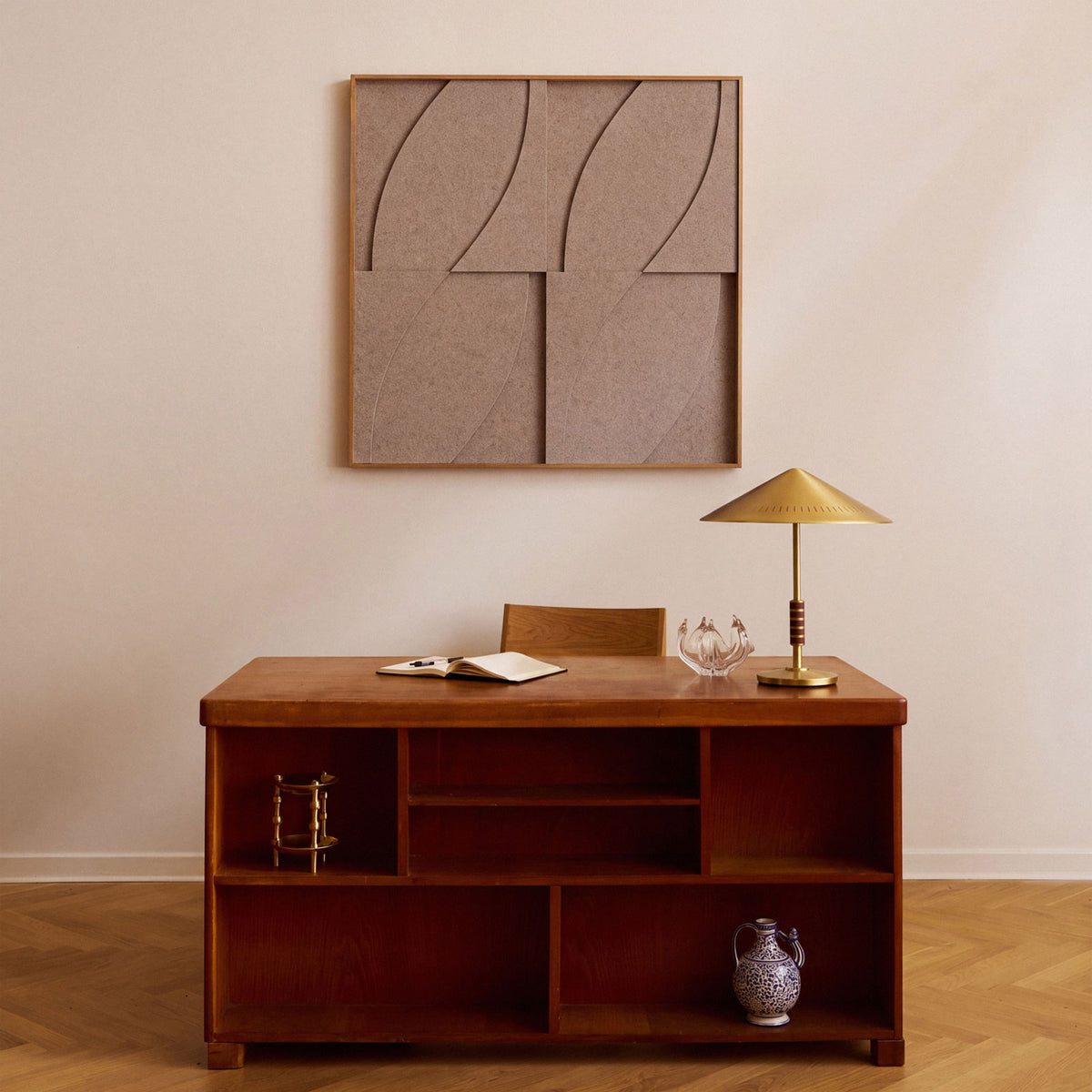 Front view of a textile acoustic artwork in taupe color with an oak frame.