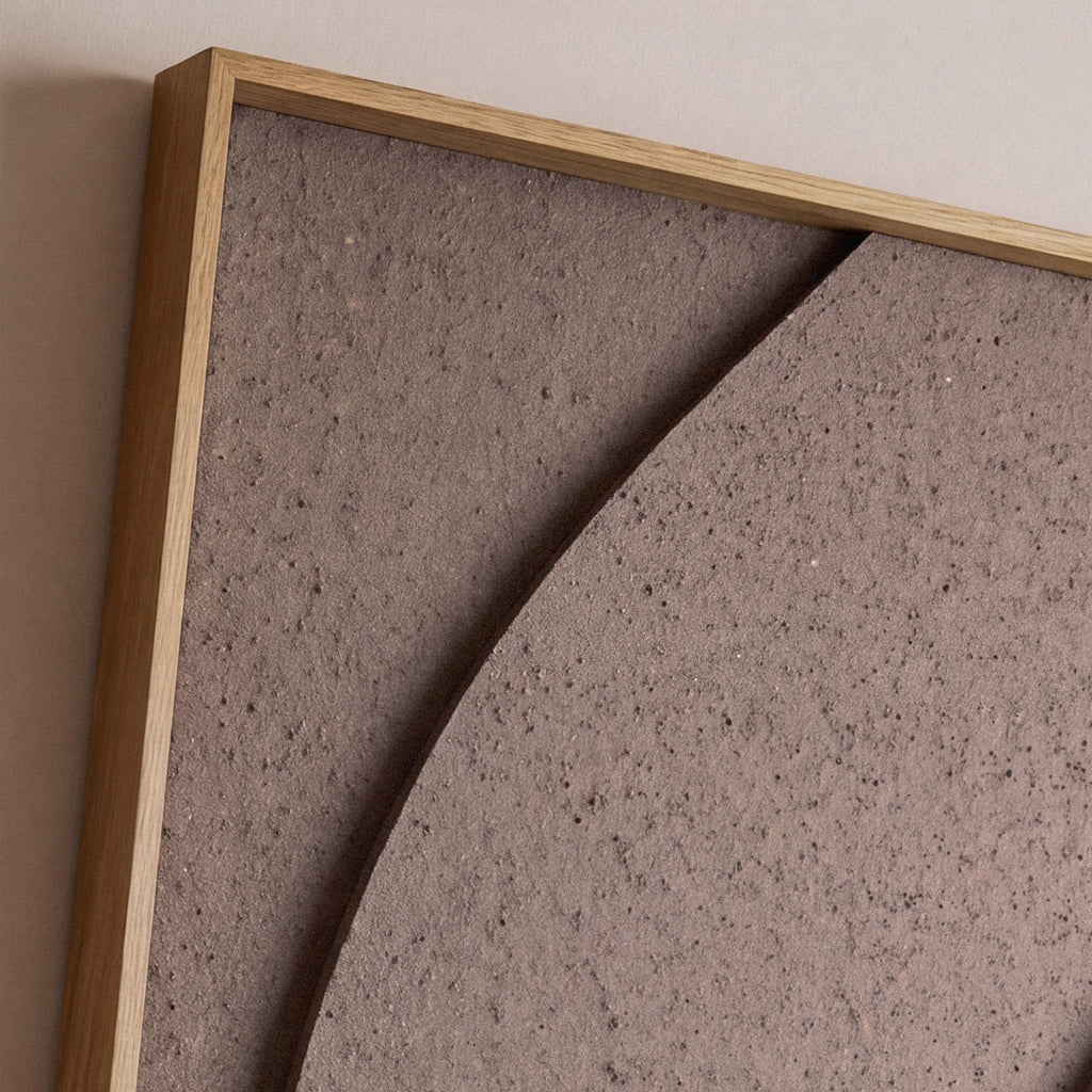 Close up of a  textile acoustic artwork in taupe color with an oak frame.