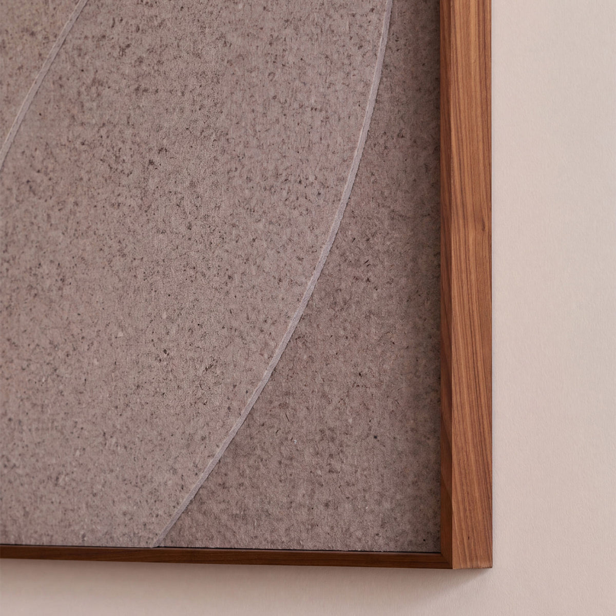 Close up of a large textile acoustic artwork in cashmere color with a walnut frame