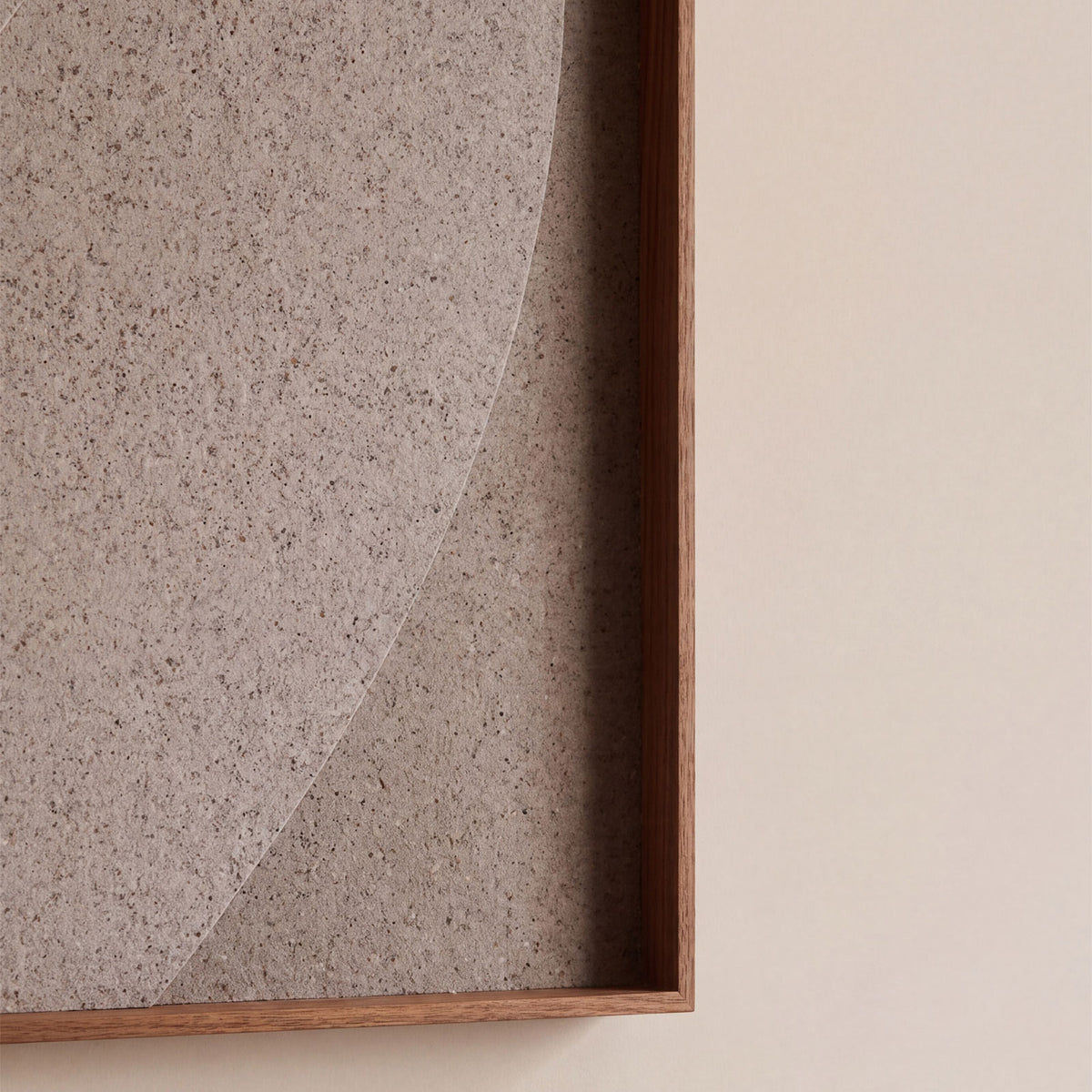 Front view of a textile acoustic artwork in taupe color with an walnut frame.