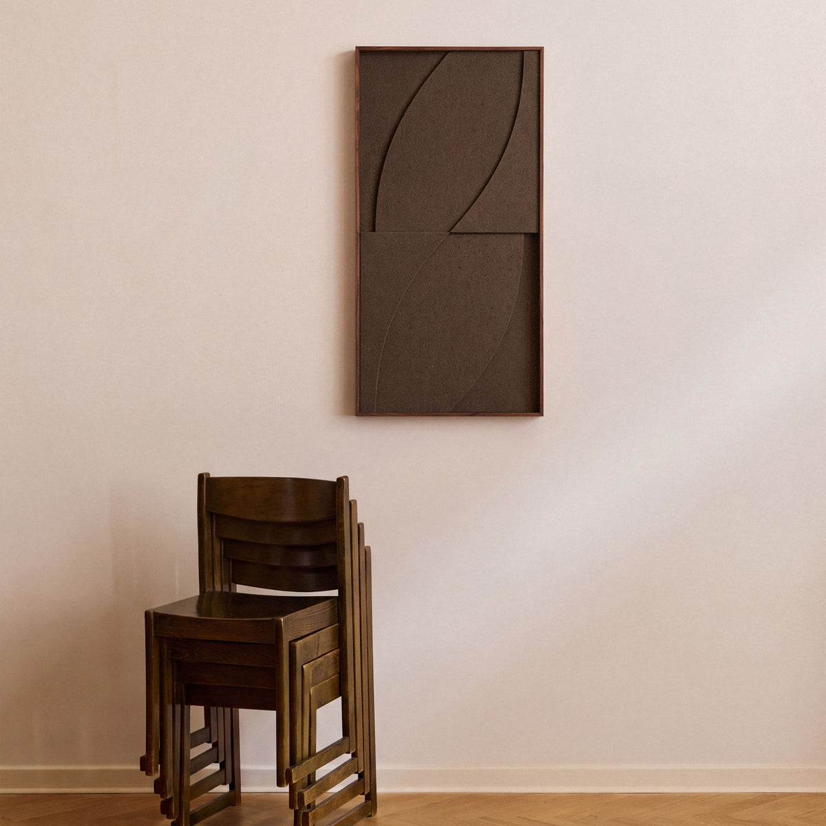 Front view of a medium sized textile acoustic artwork in dark brown color with an walnut frame.
