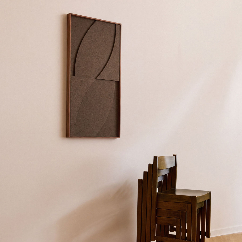 Side view of a medium sized textile acoustic artwork in dark brown color with an oak frame.