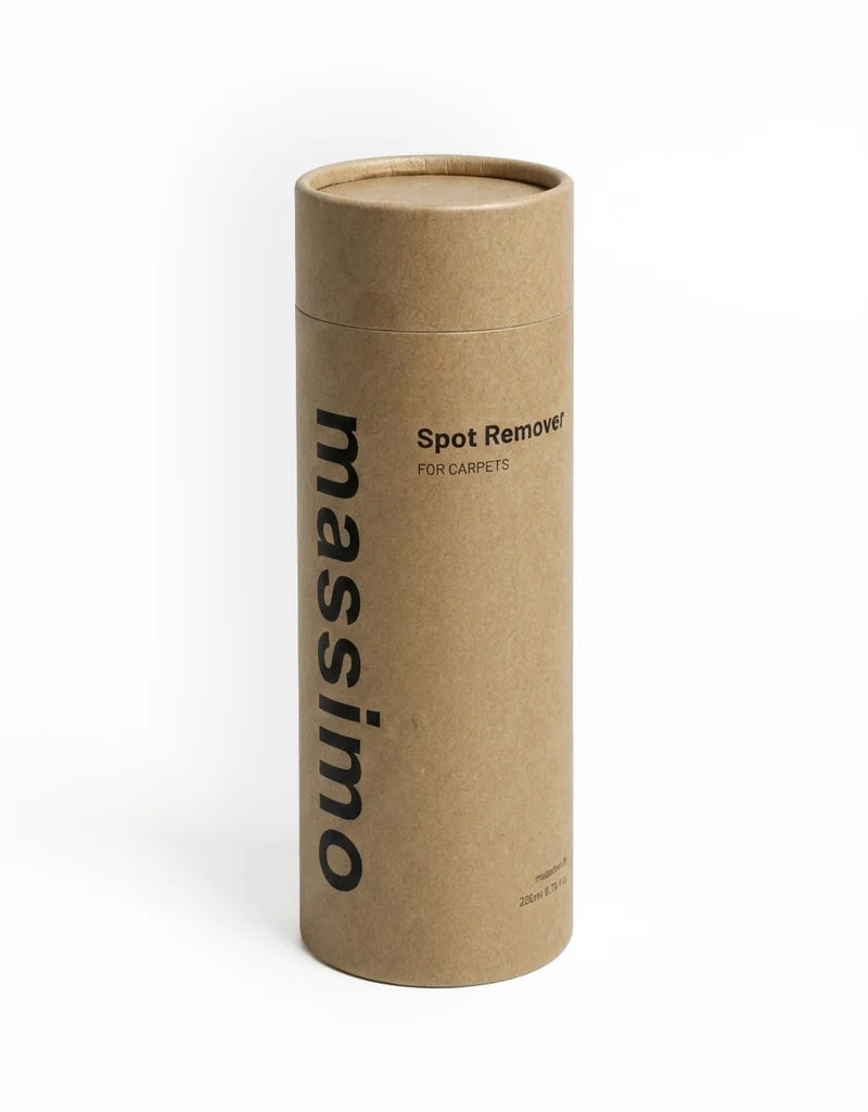 A tall, cylindrical cardboard tube package for Massimo Spot Remover for carpets, shown on a clean white background.